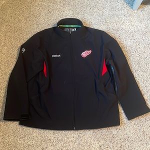 NHL Red Wings Reebok light weight jacket. Color black & red. Size XXL.